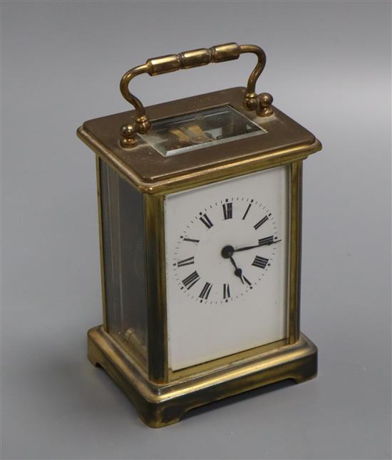 A gilt brass carriage timepiece having white enamelled dial